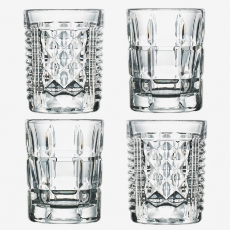 Quatre shooters After en verre pressé transparent aux décors assortis.