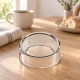 Cloche unie en verre La Rochère sur une table de petit- déjeuner avec lin et pain.